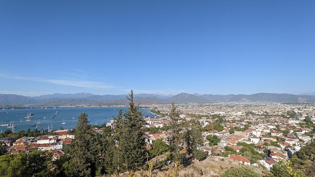 Fethiye rooftops and bay with sailboats, viewed from the hillside in 2022