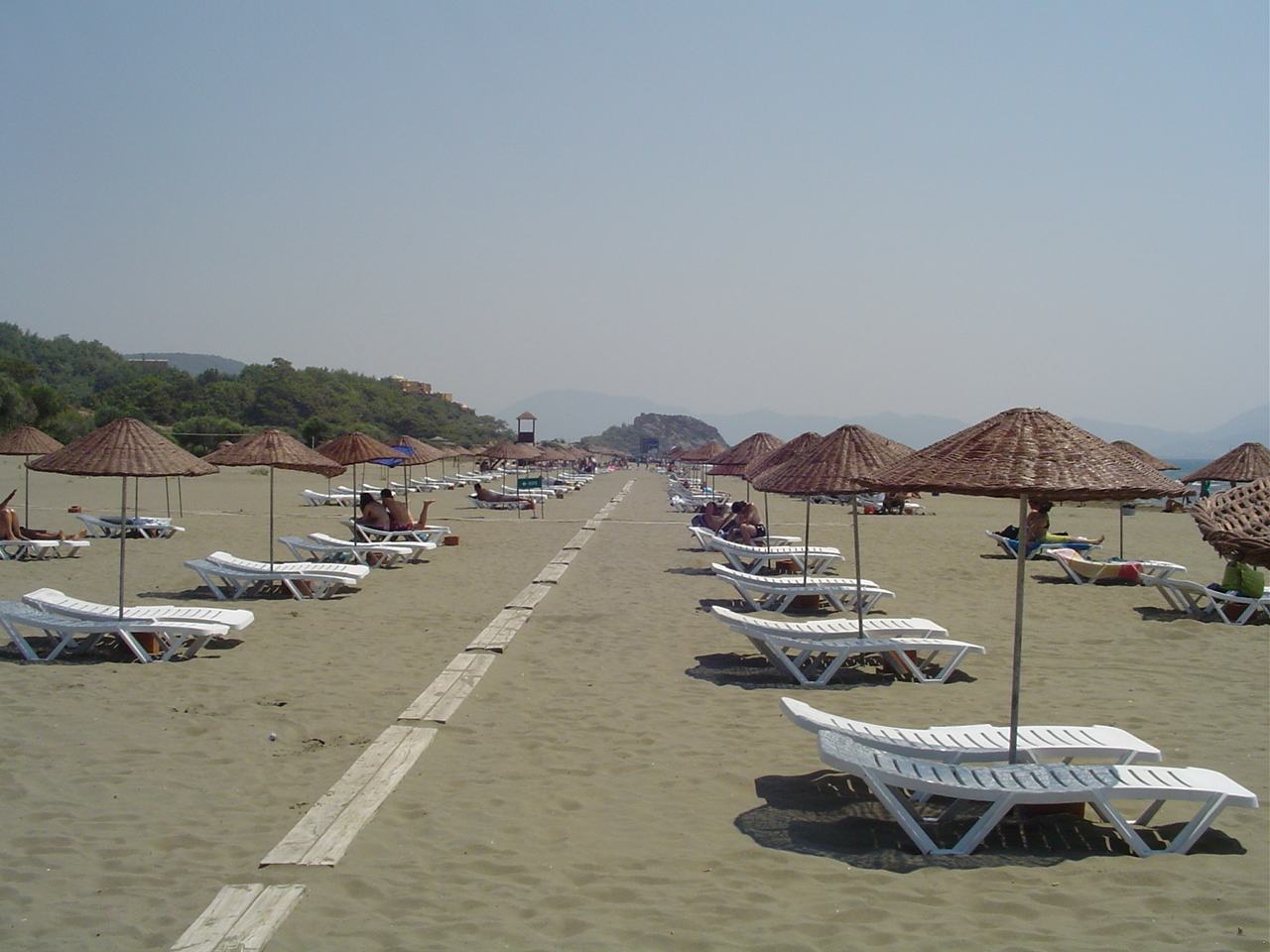 Path, parasols and loungers at Sarıgerme Beach in Ortaca